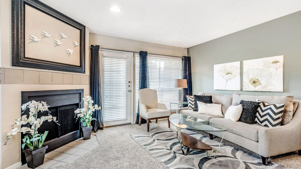 a living room with a fireplace and a couch at The  Monte