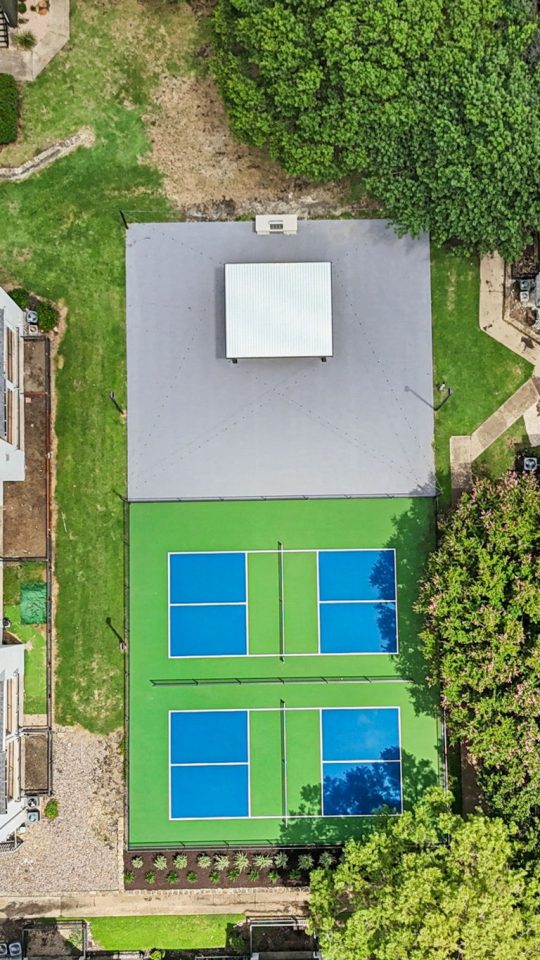 an aerial view of a tennis court in a residential neighborhood at The  Monte
